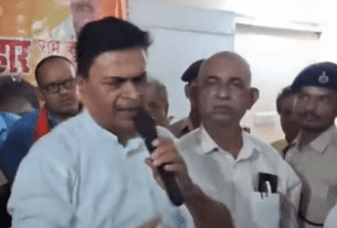 Prashant Shivaji, Shiv Sena leader, speaking at a press conference with microphones and reporters in attendance.