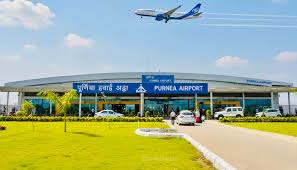 punia airport,a plane flying over airport.